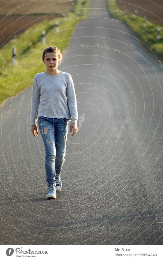 jauntily Lanes & trails Asphalt In transit Going Street Roadside naturally Walking speed Single-minded Right ahead March To go for a walk Loneliness Movement