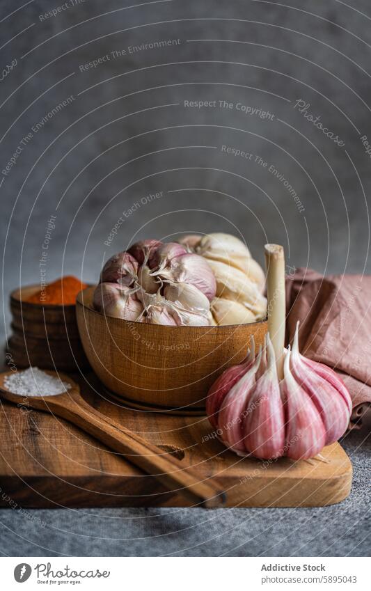 Fresh garlic and spices on rustic wooden table ingredient cooking kitchen bowl spoon salt texture backdrop food seasoning bulb fresh culinary natural organic