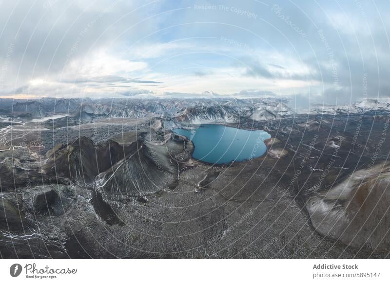 Aerial view of a remote highland lake in Iceland iceland drone view aerial view landscape serene blue rugged terrain cloudy sky mountain water nature outdoor