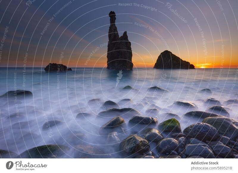 Tranquil sunset over the mystical rock formations of Madeira madeira portugal ocean coast serene dramatic landscape scenic tranquil glow mist sea nature dusk