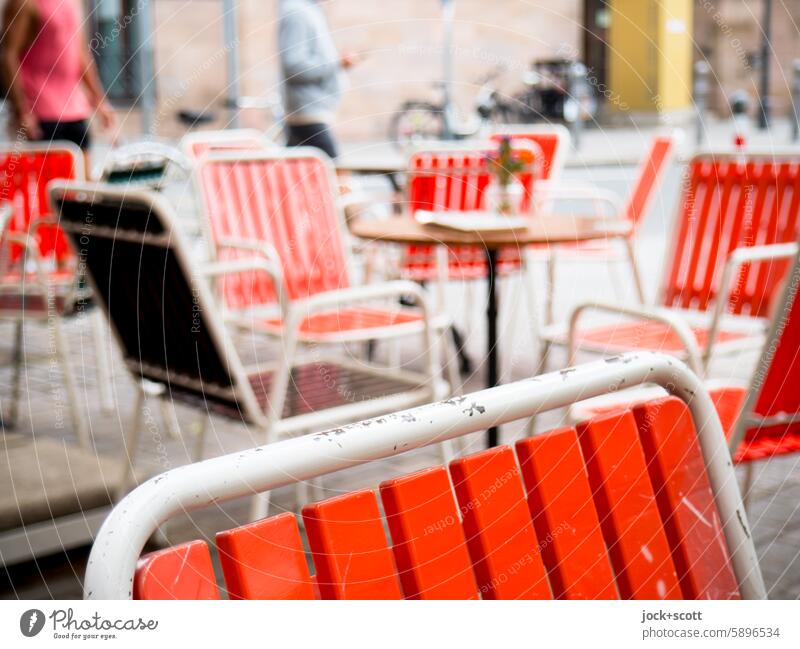 Neat chairs for outdoor use Chair Seating Gastronomy Table Passers-by Sidewalk café blurriness Nostalgia Café Deserted Second-hand Nuremberg Scene symmetry