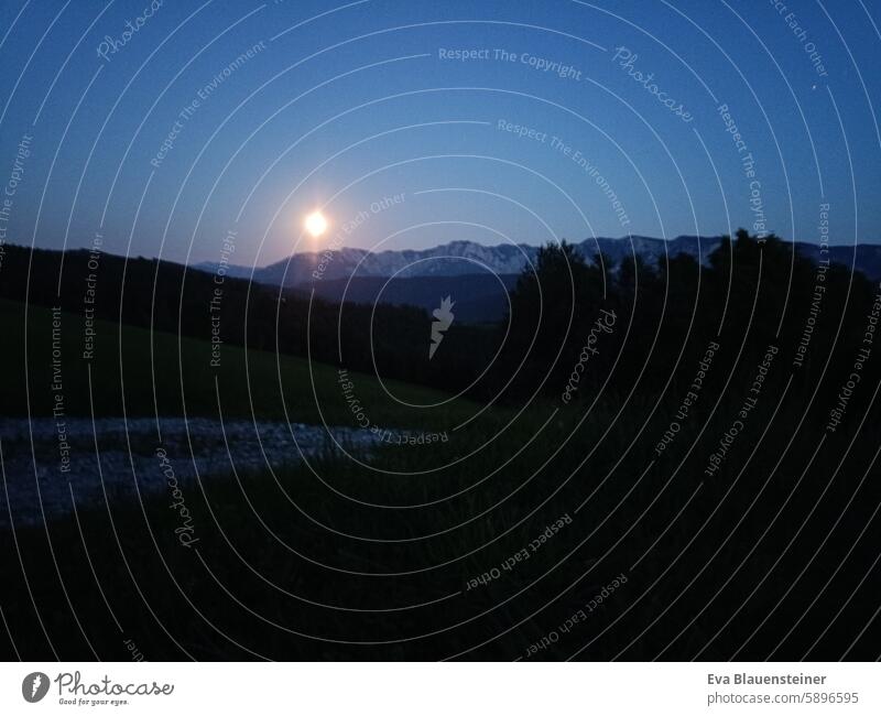 Moon rises over mountain massif Moonlight Dark darkness Mountain mountains Sky Night Full  moon Night sky Illuminate off Lanes & trails Nature Moonrise