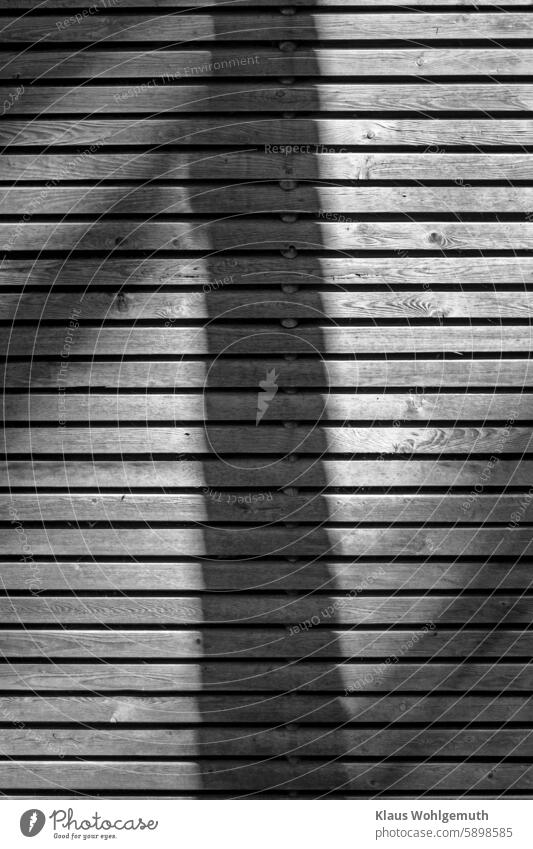 Geometric shadow cast on a wooden fence, round shadow, iwaz. Fence Wooden fence Privacy fence wooden crate wood panelling Texture of wood Light and shadow