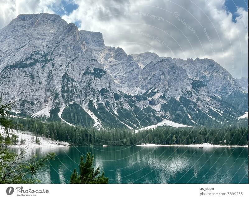 Braies Wild Lake Alps mountains Turquoise Green Waves Mountain Water Landscape Nature Sky Blue Clouds Exterior shot Summer Lakeside Colour photo Environment