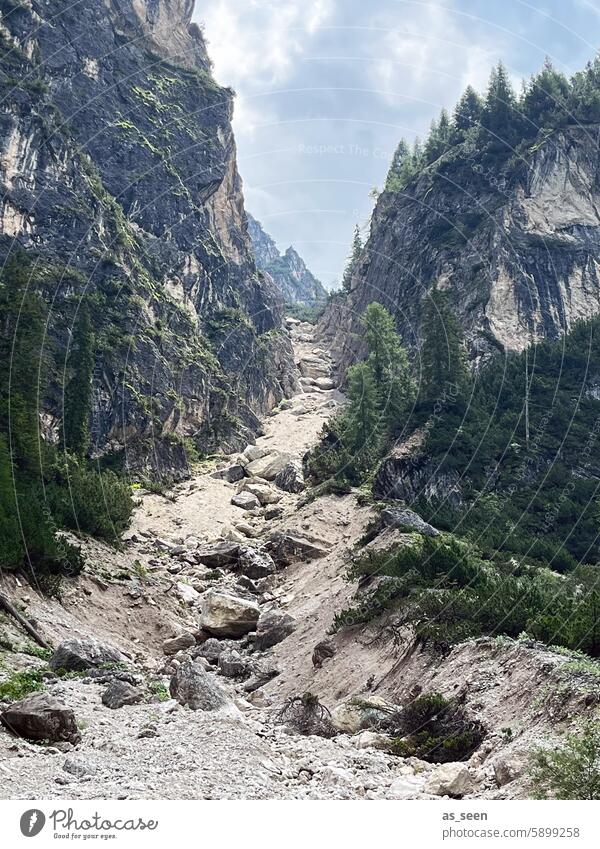 Cutting a path in the rock Gravel Rock Mountain Nature Sky Landscape Clouds Exterior shot Deserted Colour photo Peak Environment Hiking Vacation & Travel Alps