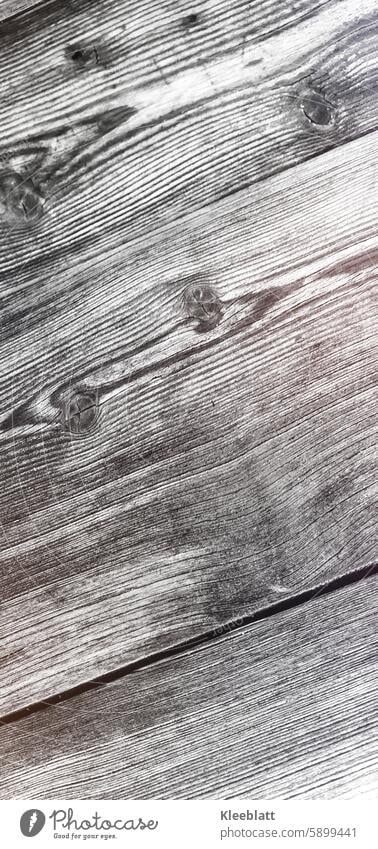 Gray, slightly brownish, slanted wooden floorboards - portrait photo Portrait format Background picture Base photo obliquely a lot of free text space