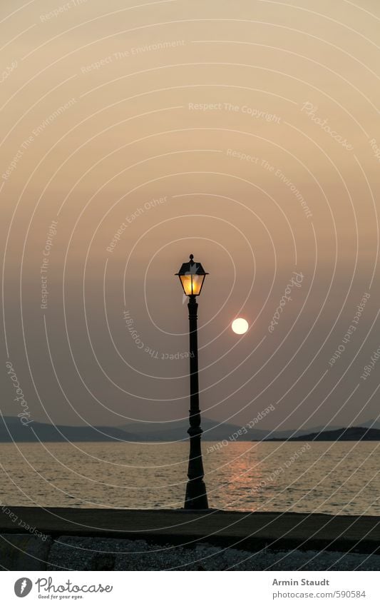 Old lantern and sunset Style Vacation & Travel Summer Nature Water Sky Cloudless sky Sun Beautiful weather Ocean Naxos Skyline Harbour Street lighting