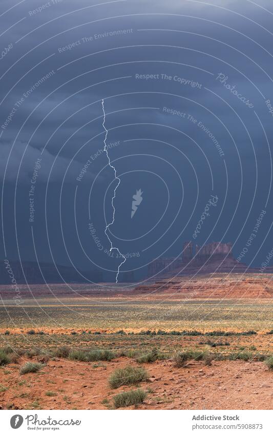 Dramatic lightning strike over Monument Valley during storm monument valley landscape butte desert sky cloud nature dramatic weather electric electrical