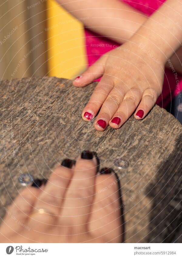 a woman and a child show their nail polish - close-up of hands Woman Child Fingers Nail polish Red Black opposites youthful Old macri maro Childlike log