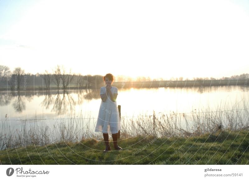 spring awakening Lake Ocean White Green Winter Dress Reflection Surface of water Morning Ease Red Red-haired Easter Monday Coast Longing Cold Supercooled Spring