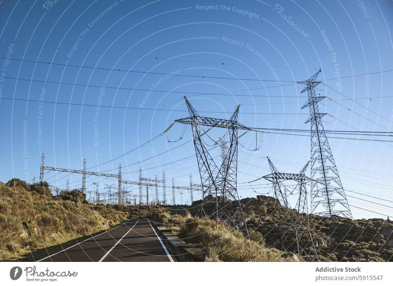 Vast network of electrical power lines from a hydroelectric plant spain high-voltage countryside blue sky infrastructure energy supply transmission tower