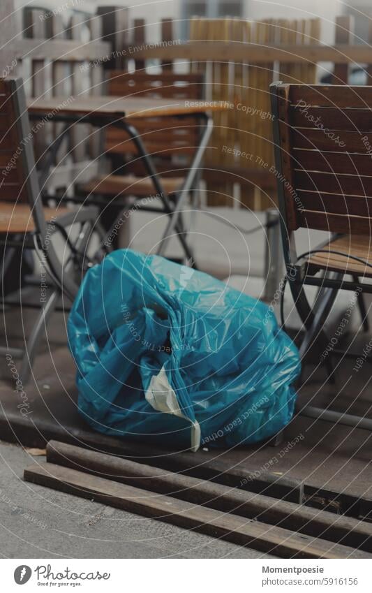 Garbage bag in the city Town Trash Café Restaurant City life urban Exterior shot Street Deserted Outdoors Colour photo Gastronomy Sidewalk café Lifestyle Table