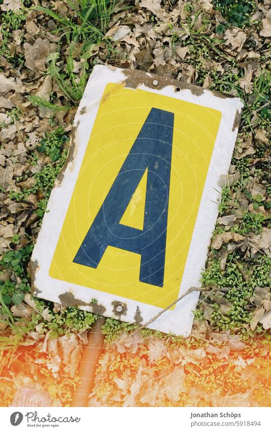 Letter A on a sign letter a typography esteem Yellow Text Word writing Remark embassy single letter Highway ramp (exit) Beginner Analog Retro lightleak vintage