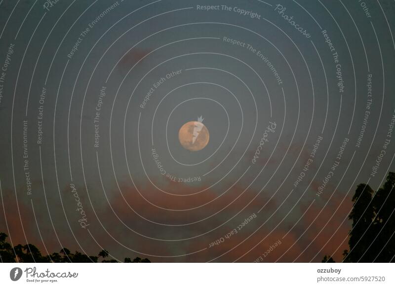 Full moon and clouds at dusk cloudscape nature sky ethereal moonlight no people twilight night dark sunset environment atmospheric mood astronomy dawn glowing