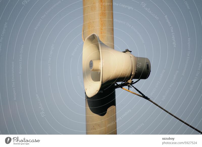 Loud speaker hanging on the pole megaphone color image communication horizontal announcement message no people voice concepts ideas noise copy space