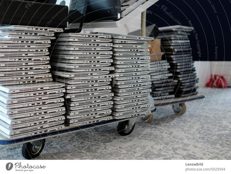 Stack of laptops in the storage room of a company broken business business finance and industry computer damaged distribution warehouse electrical equipment