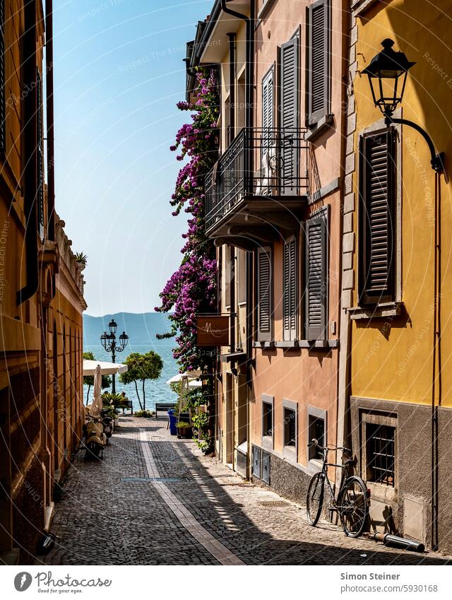 Street in a town on Lake Garda in Italy Looking Water Town