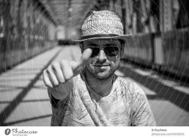 Man with sun hat and sunglasses on an old bridge Hat Rudbeckia Summer Eyeglasses Sunglasses Bridge Black & white photo Vacation & Travel portrait Exterior shot