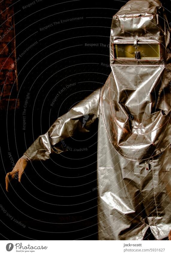 source of danger | then with protective suit Protective clothing Workwear Working man Safety Work and employment heat-protective suit Protection