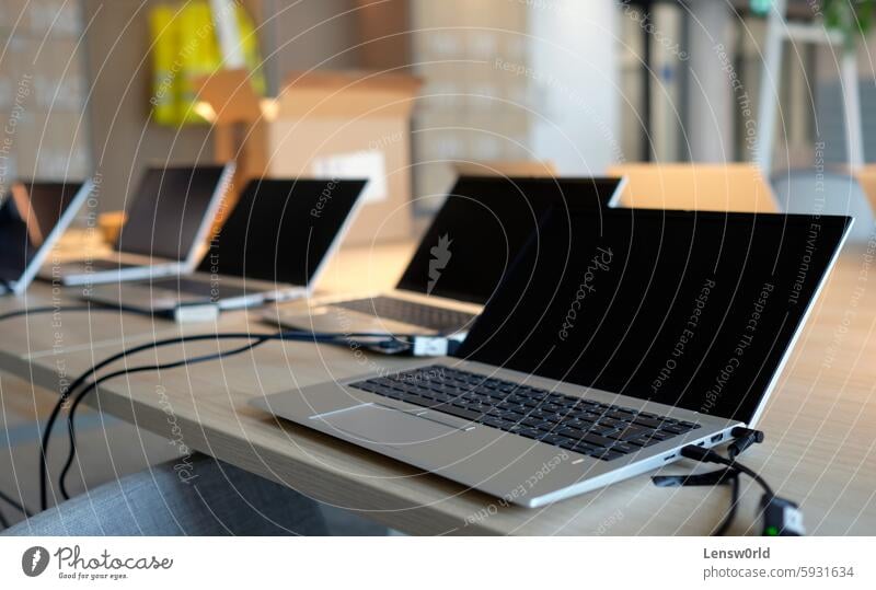 Laptops on a table in a co-working space business co working space computer cooperation corporate corporate business corporate culture coworking coworking space