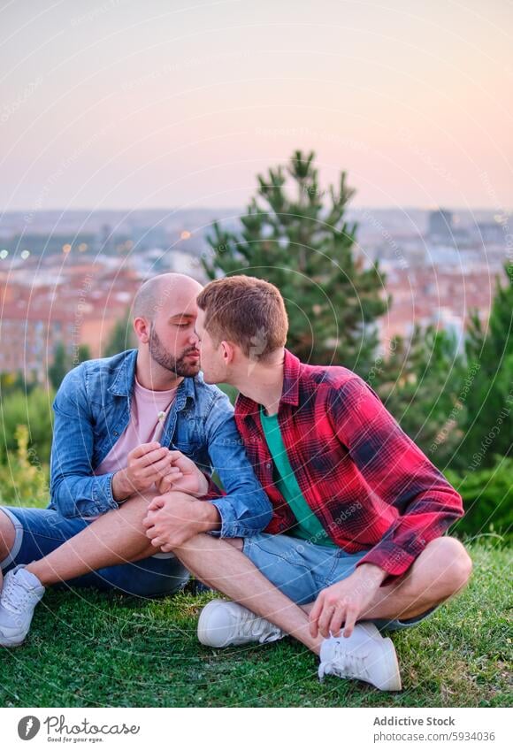 Loving gay couple sharing a tender moment outdoors love affection kiss intimate bonding sunset cityscape serene romantic homosexual relationship togetherness