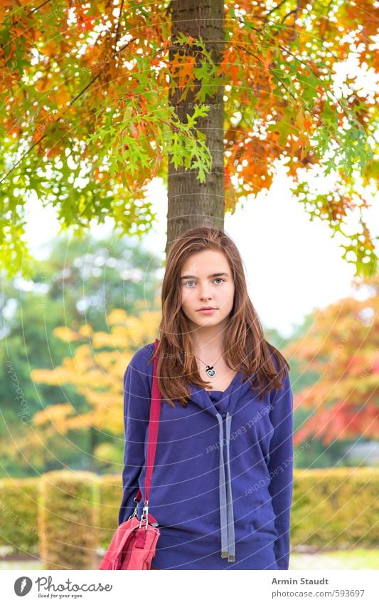 Girl with bag under an autumn tree Lifestyle Human being Feminine Woman Adults Youth (Young adults) 1 13 - 18 years Child Nature Autumn Beautiful weather Tree