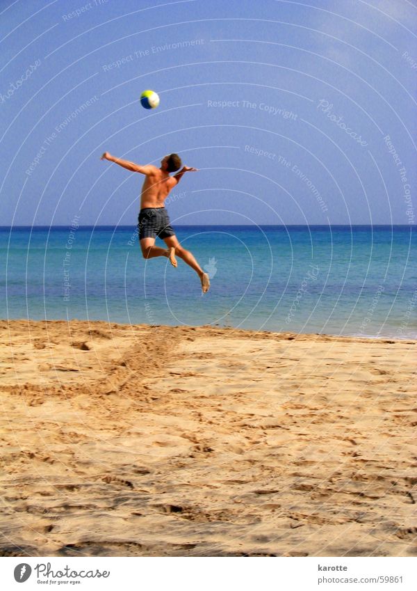 ... and over with it! Volleyball (sport) Service Jump Force Ocean Atlantic Ocean Fuerteventura Beach Weightlessness Exterior shot Tall Sand sea Energy industry