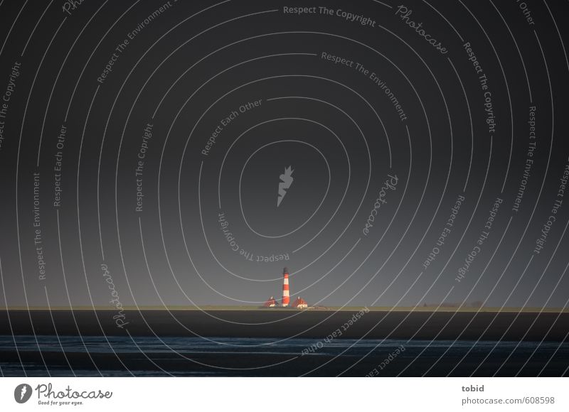 Lonely lighthouse Far-off places Beach Ocean Lighthouse Elements Air Sky Storm clouds Sunlight Winter Bad weather Wind Coast North Sea Mud flats Promontory