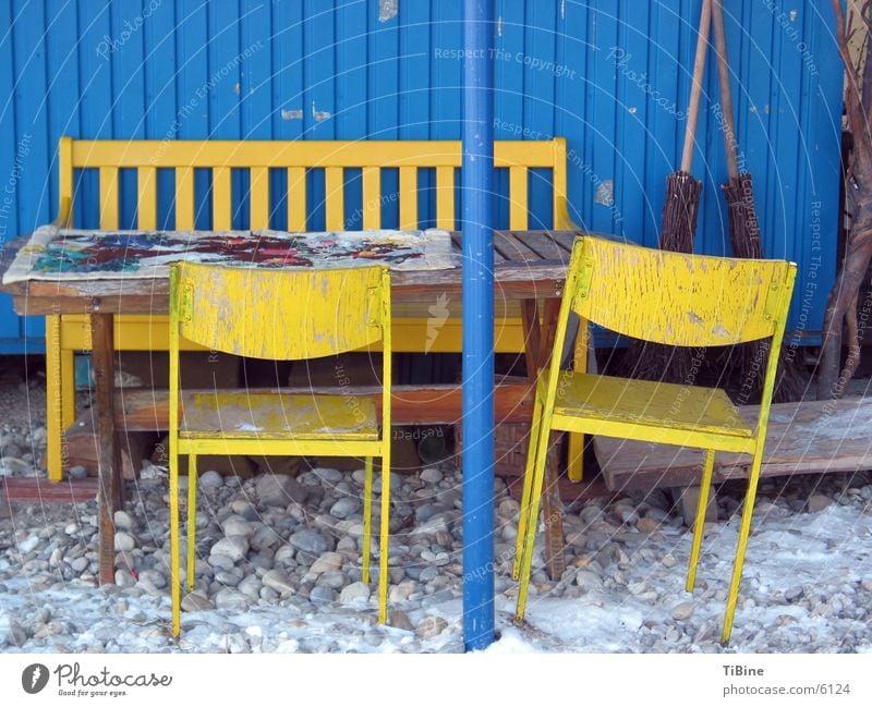 Still life in blue and yellow 2 Table Chair Yellow Site trailer Still Life Living or residing Blue Bench Exterior shot