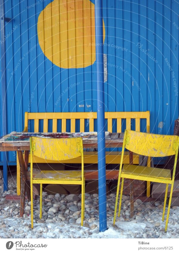 Still life in blue and yellow Table Chair Yellow Site trailer Still Life Living or residing Bench Blue Exterior shot