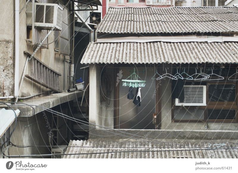 made in taiwan House (Residential Structure) Building Housing area Balcony Laundry Hanger Gray Turquoise Roof Corrugated sheet iron Window Harmful