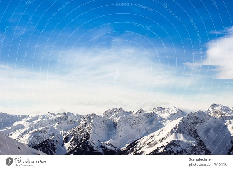 Mountain paradise Nature Landscape Sky Clouds Winter Climate Wind Ice Frost Snow Tree Alps Montafon Snowcapped peak Far-off places Friendliness Large Tall Blue