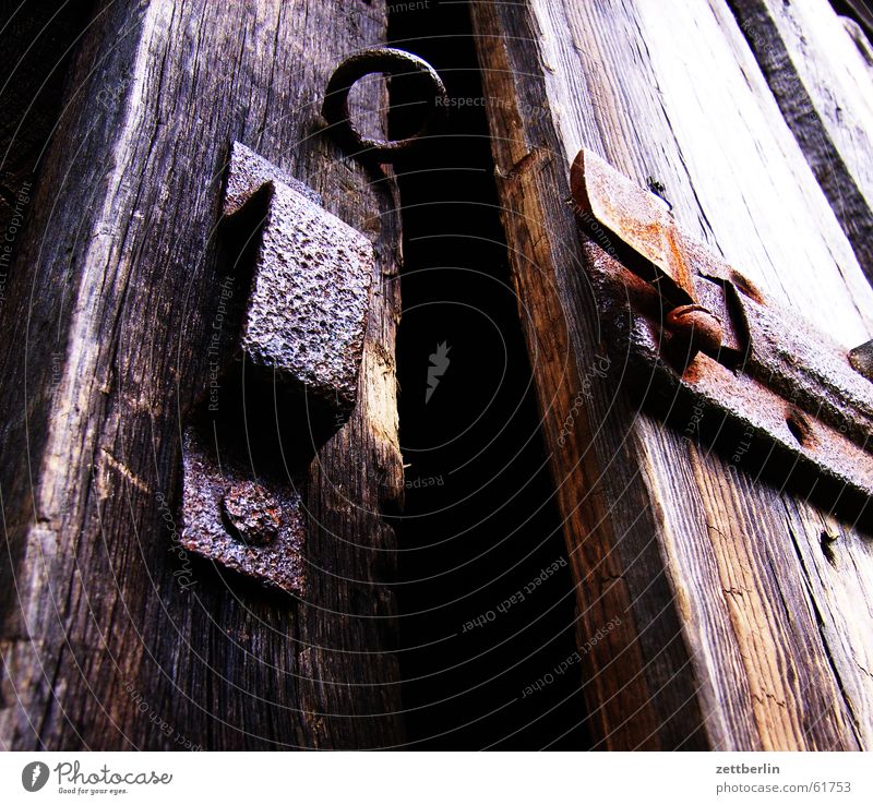 fissure Locking bar Dark Closed Mysterious Creepy Key Gardening equipment Rake Spade Watering can Castle Barn Rust Door Column Open Frightening