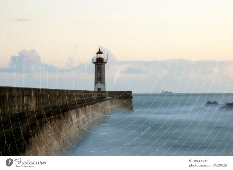 Lighthouse in twilight Calm Vacation & Travel Beach Ocean Waves Nature Landscape Sky Clouds Horizon Coast Dark Blue Safety artistic Silent porto Matosinhos