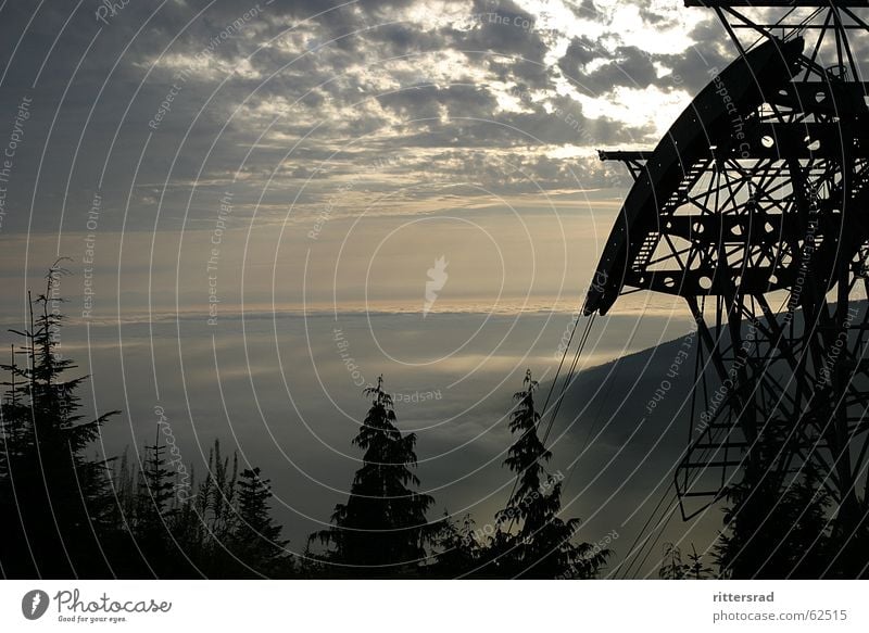 Wide view over Vancouver Canada Rocky Mountains Fog Sunset Forest Steel Cable car Calm crouse mountain Sky Technology Far-off places