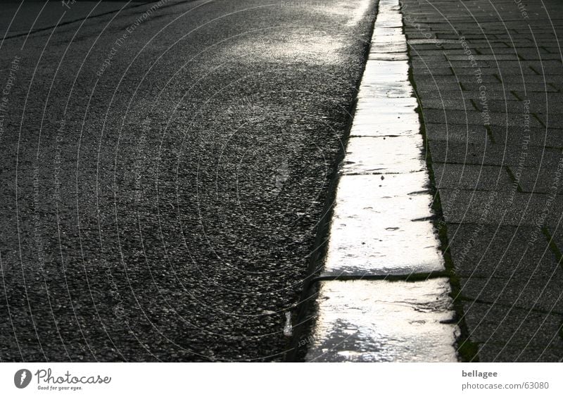 a slightly different dream Tar Light Back-light Moody Curbside Sidewalk Pattern Corner Asphalt Wet Perspective Frontal Street Evening Stone Rain reflection