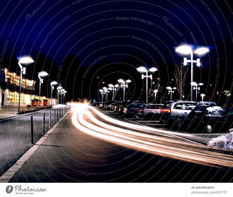 Where's my parking space? Parking lot Lamp Transport Driving Long exposure Night shot Exterior shot Dark Car vehicles Movement Floodlight motion Light