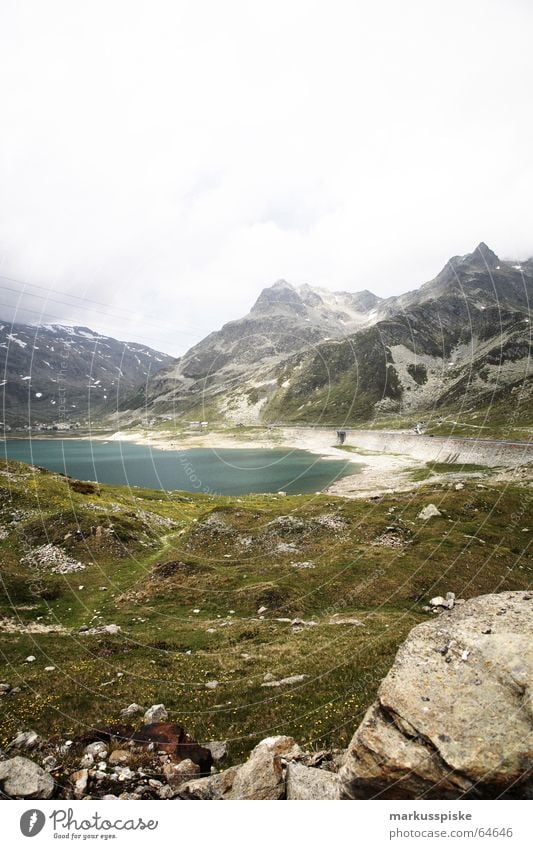 Lago di Montespluga 1901m Alpine Lake Reservoir Meadow Green Turquoise Switzerland Italy Sea level Clouds Mountain Rock Snow Alps splügenpass Sky