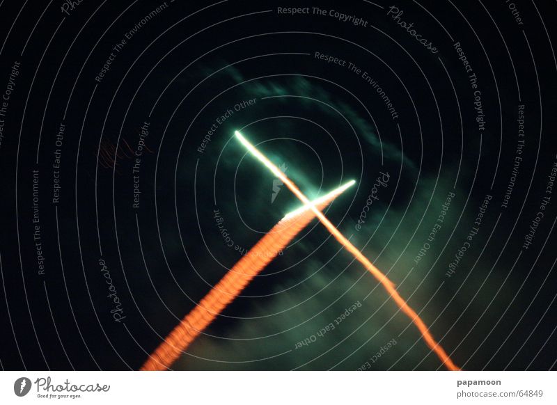 the big X Dark Light Clouds Green Comet Tails Firecracker Smoke Orange Back