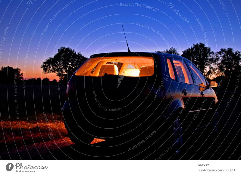 Lonely night ride Night Night journey Motor vehicle Bright Tree Blue Antenna Wheel rim Aluminium Sunset Lower Saxony Germany Night shot Car 9n Seating silhoutte