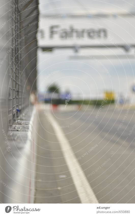 Driving Motorsports Racecourse Speed Athletic straight Speedway race racetrack Colour photo Exterior shot Deserted Blur Central perspective