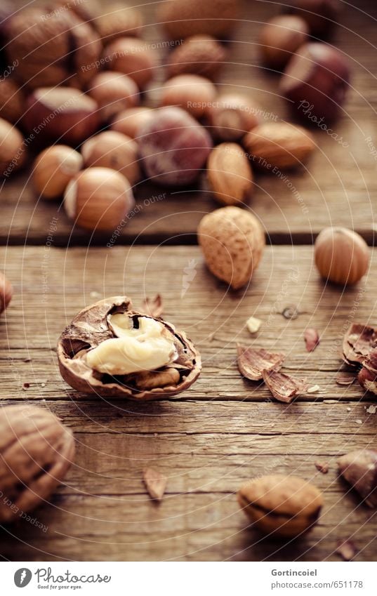 walnut Nutrition Organic produce Vegetarian diet Slow food Finger food Healthy Brown Walnut Almond Hazelnut Wooden table Food photograph Christmas & Advent