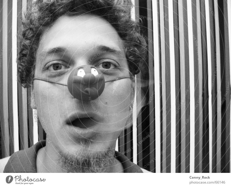 Smoking clown without a crown Carnival fool Cigarette Circus Grief Facial hair Breath Stripe Pattern Striped Vertical Impish Portrait photograph Man Clown Smoke