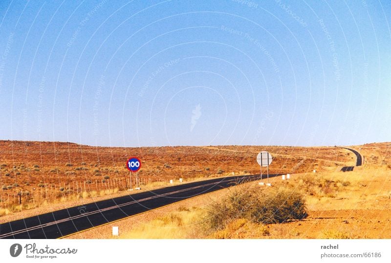 N7 Namibia Country road Freeway Empty Deserted Semi-desert Asphalt Road sign Speed limit Horizon Namaqualand Loneliness Badlands Blue sky Clear sky