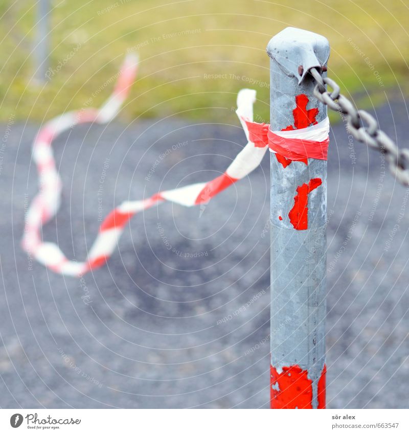 makeshift Parking lot Meadow Barrier Gravel Chain Packing film Metal Gray Red Gravel path Gravel road Torn Broken Problem solving Exterior shot Copy Space left