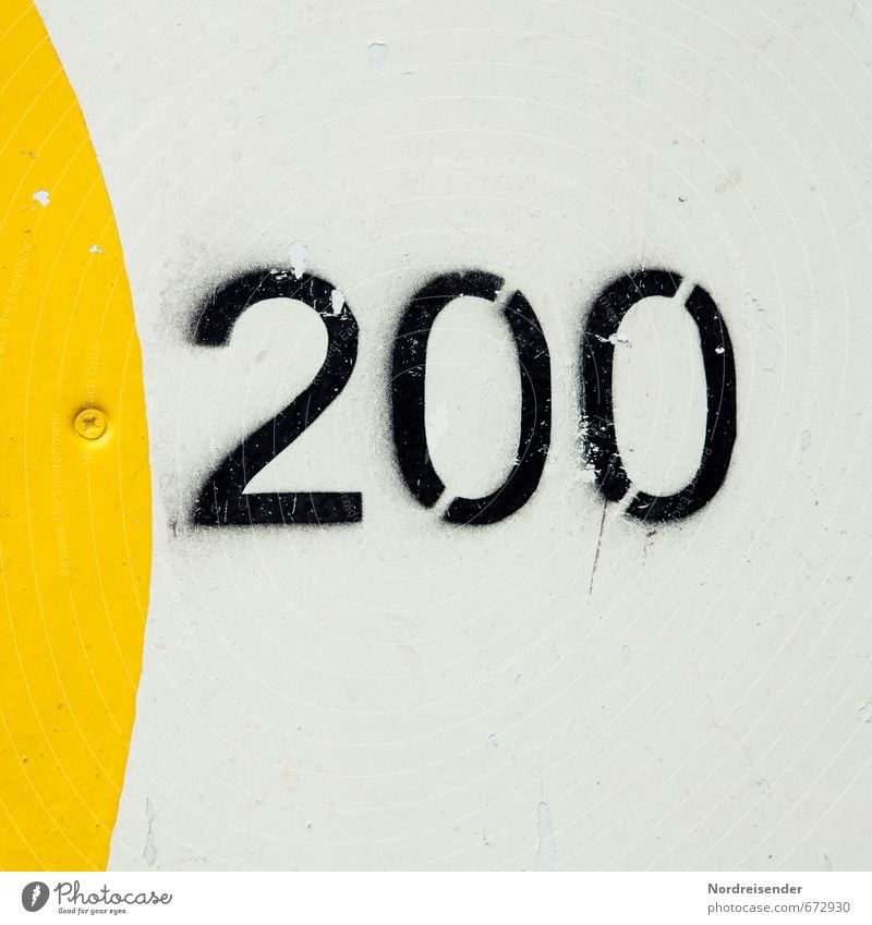 Of course.... Playing Game of chance Wall (barrier) Wall (building) Sign Digits and numbers Signs and labeling Speed Yellow Black White 200 two hundred