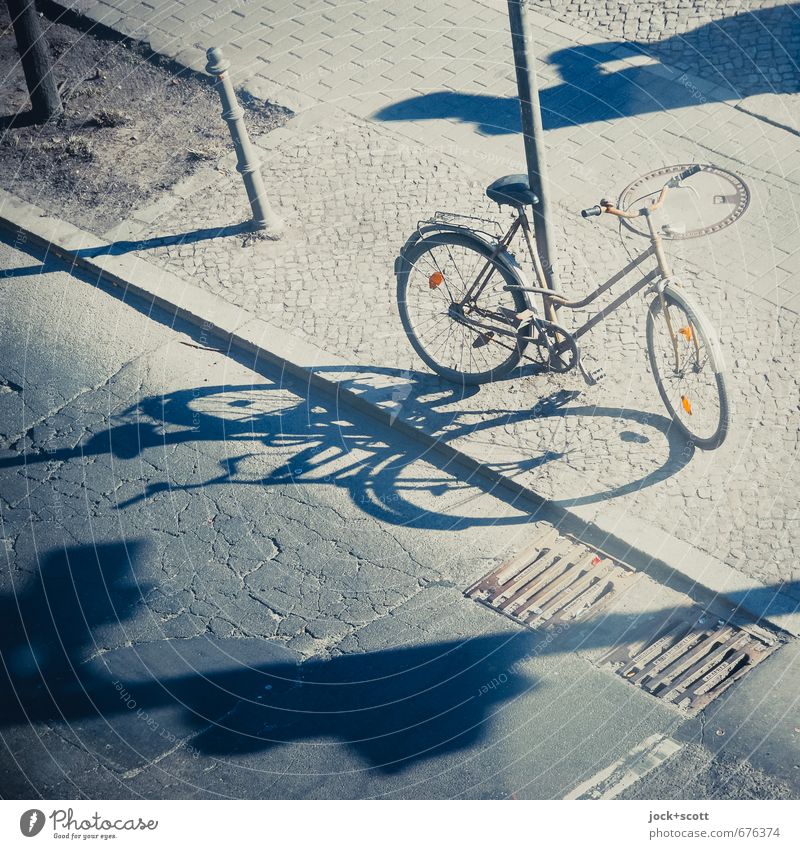 Shadow play with bicycle Summer Kreuzberg Street Sidewalk Bicycle Gully Reflector Safety (feeling of) Associated Distorted Crack & Rip & Tear Fantasy Parking