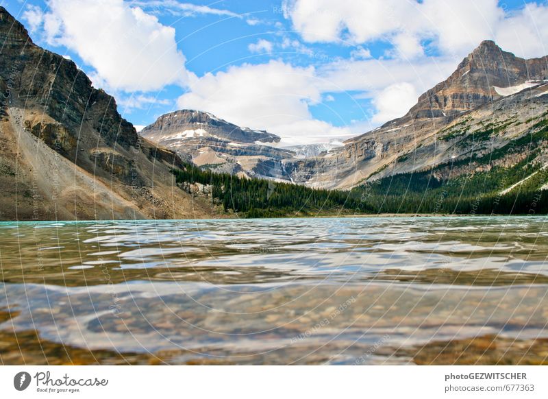 At the lake Environment Nature Landscape Air Water Sky Clouds Horizon Summer Beautiful weather Tree Mountain Peak Waves Lakeside Moody Colour photo