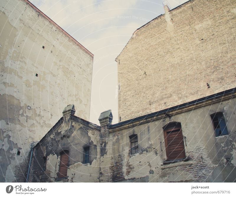 time-honored Art nouveau Sky Commercial building Facade Window Fire wall Backyard Old Apocalyptic sentiment Past Ravages of time Corner Column Subdued colour