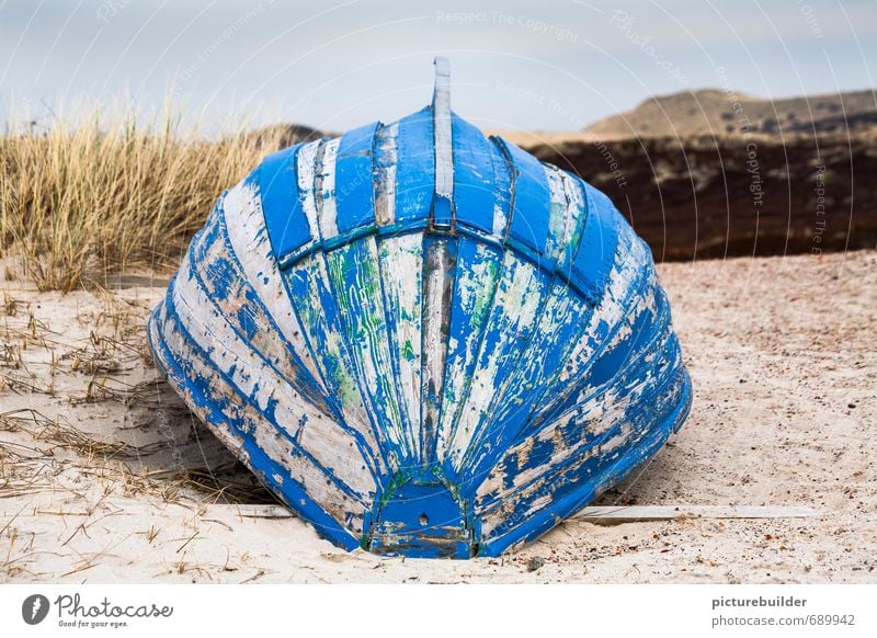 Blue boat keel top Nature Landscape Sand Beach North Sea Ocean Deserted Navigation Rowboat Wood Calm Loneliness Stagnating Sylt Colour photo Exterior shot